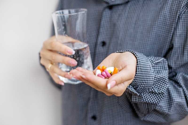 a women taking pills